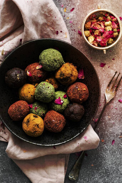 Healthy chickpea truffles with dried fruit on a table - Фото, изображение