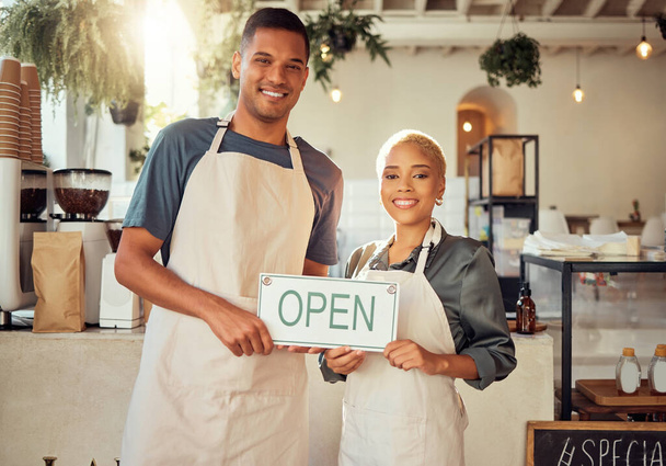 Colleagues, coworkers and small business owners with open sign and happy at restaurant in support together. Team, collaboration and friends smiling for startup growth and proud of success or vision. - Foto, imagen