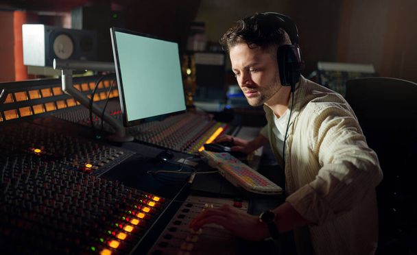 Man, thinking or recording headphones for music, sound mixing or computer song composition in studio. Musician, DJ or producer on technology with ideas for live streaming radio, audio or media album. - Φωτογραφία, εικόνα