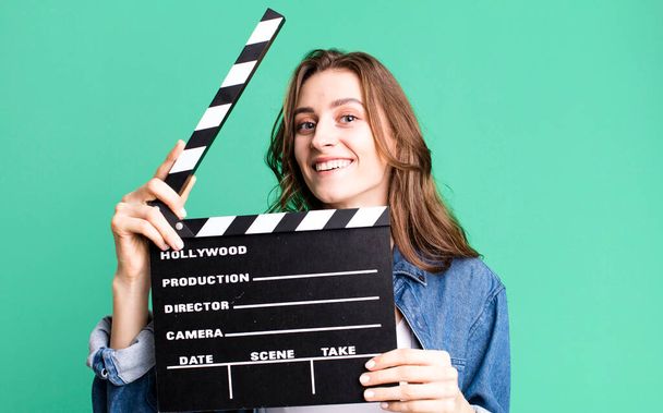 young pretty woman holding a clapper cinema board - Zdjęcie, obraz
