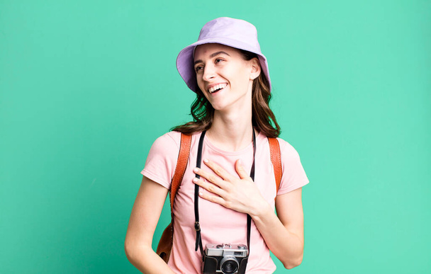 young pretty woman laughing out loud at some hilarious joke. tourist concept - 写真・画像