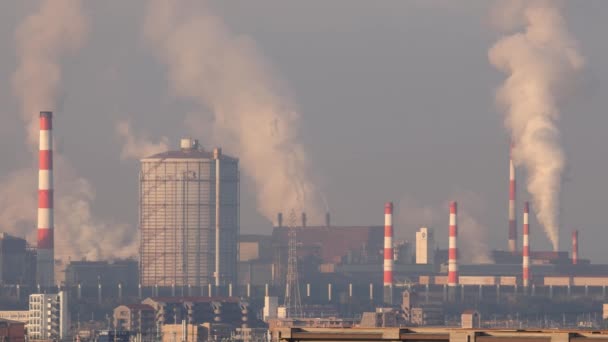Smokestack Emissions and Large Storage Tank at Industrial Plant. High quality 4k footage - Πλάνα, βίντεο