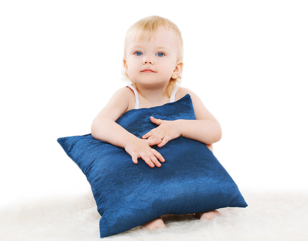 Cute child with a pillow on a white background - Fotografie, Obrázek