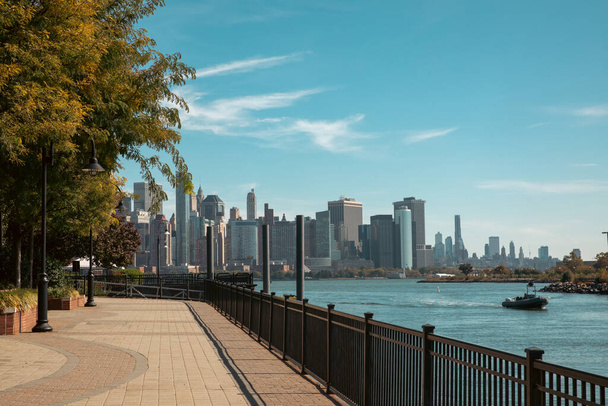 scenic view of Manhattan skyscrapers from embankment of Hudson river in New York City - Foto, Imagem