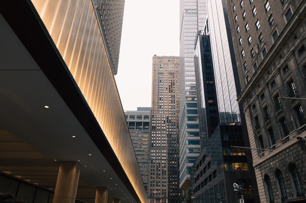 illuminated entrance of building on urban street in midtown of New York City - Φωτογραφία, εικόνα