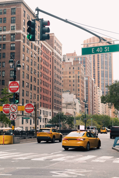NEW YORK, USA - OCTOBER 13, 2022: traffic light above road with cars in Manhattan - Fotó, kép