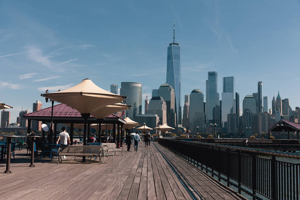 NEW YORK, USA - OCTOBER 11, 2022: People on Hudson river waterfront walkway at daytime  - 写真・画像
