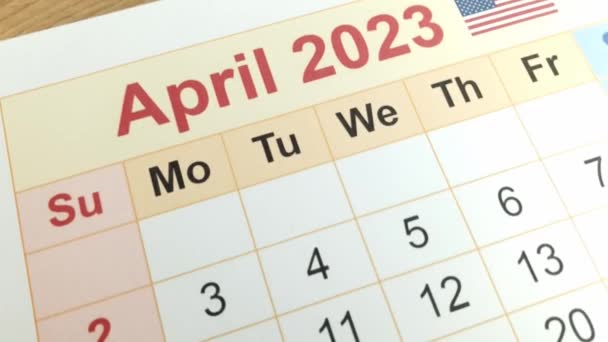 Tax payment day marked on a calendar - April 18, 2023, financial concept - Metraje, vídeo