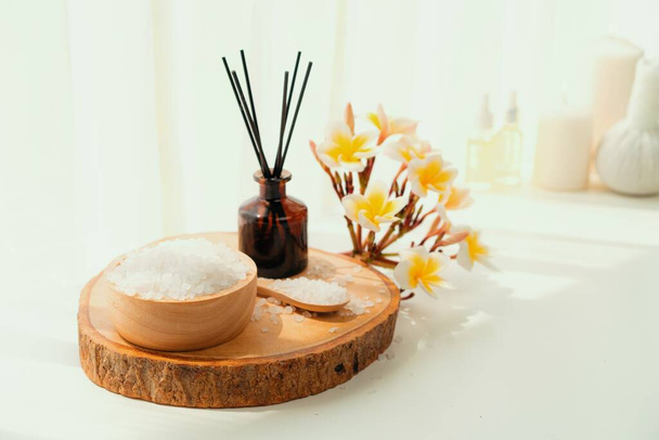 Spa accessory composition set in day spa hotel , beauty wellness center . Spa product are placed in luxury spa resort room , ready for massage therapy from professional service . - Foto, imagen