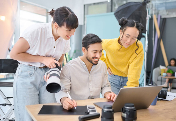 Photographer, collaboration and laptop with a designer team working on a photoshoot in the studio. Photography, teamwork or computer with a man and woman creative group for a post production edit. - 写真・画像