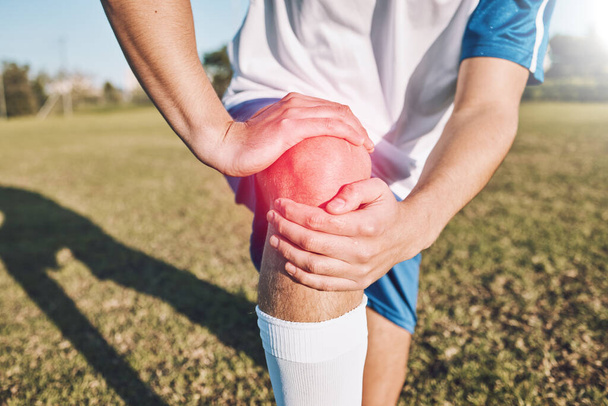 Sports, knee pain and hands on field or football competition, training and exercise injury with anatomy and red overlay. Soccer, fitness and athlete person or man leg for medical emergency or risk. - Foto, Imagem