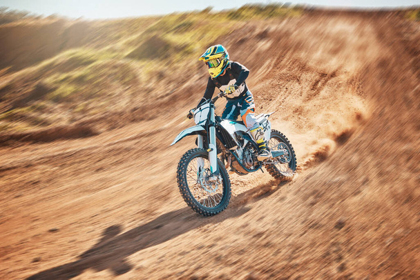 Sport, motorcycle and person driving in a desert for fitness, training and extreme sports in nature. Biking, motorbike and athletic practice stunt, speed and adrenaline in sand, exercise and freedom. - Valokuva, kuva