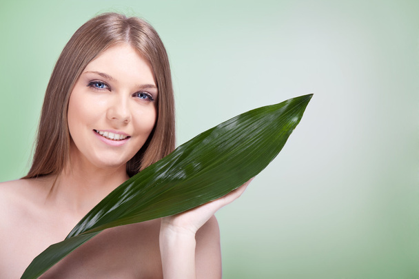 Woman skincare with plant - Photo, image