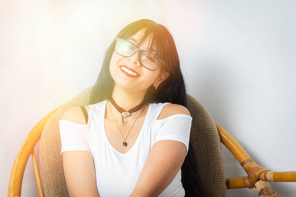 tender young mexican woman with glasses smiling - Foto, imagen