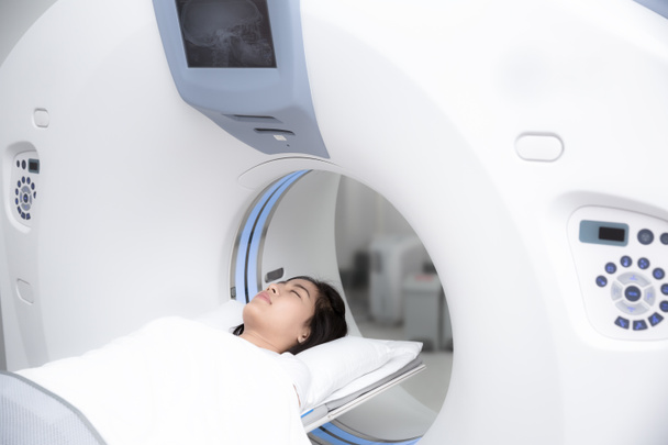 Asian lady sleep on a CT Scan bed - Photo, Image