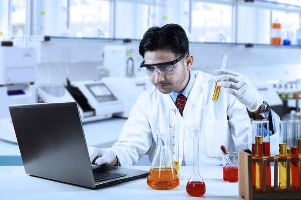 Scientist doing research in laboratory - Photo, Image