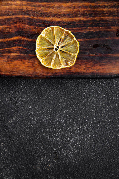 dried lemon round lemon slice healthy meal food snack on the table copy space food background rustic top view - Photo, image