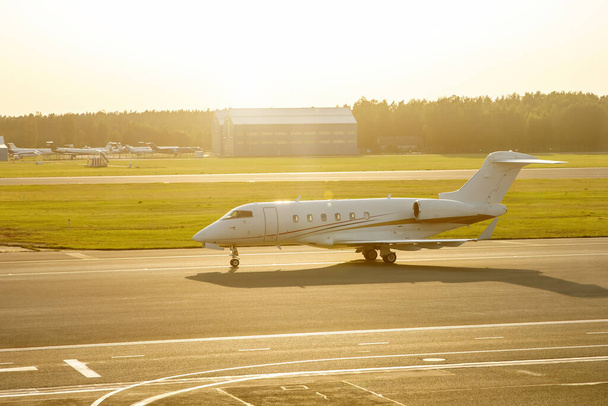A small luxury private business jet on the airport runway strip - Photo, Image