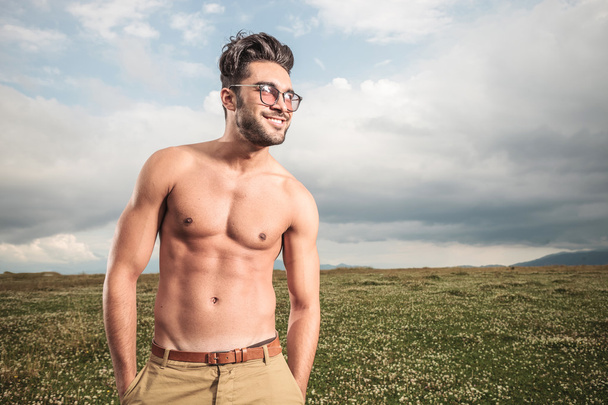 Hot shirtless man posing with his hands in pockets  - Foto, imagen