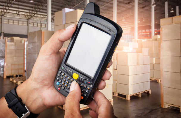 Warehouse Worker Holding Mobile Phone Contacting to a Customer. Shipment. Inventory Management at Storage Warehouse. Cargo Shipping Customers Service. - Photo, Image