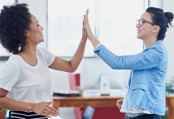 Way to go. two female coworkers high-fiving in an office - Zdjęcie, obraz