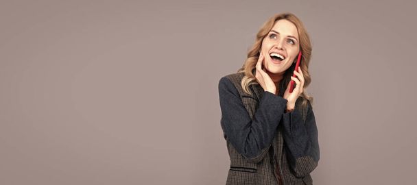 happy business woman in checkered english jacket speak on phone, communication. Woman portrait, isolated header banner with copy space - Fotó, kép