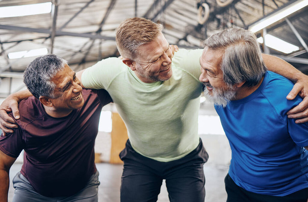 Happy, hug or mature men in workout gym, training exercise or healthcare wellness in success celebration. Smile friends, elderly or embrace in fitness teamwork, collaboration or diversity community. - Photo, Image