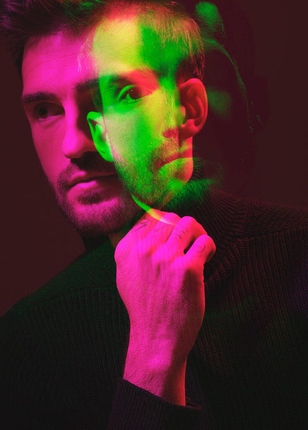 Double exposure, color and portrait of a man thinking isolated on a dark background in studio. Texture, design and face of a man with colorful overlay, creativity and digital concept on a backdrop. - Fotografie, Obrázek