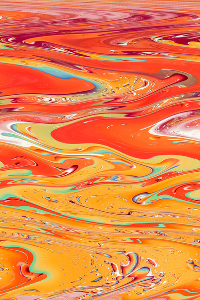 Distorted photo, abstract background in yellow-orange tones. Psychedelic, colorful pattern. Vertical photo - Photo, Image