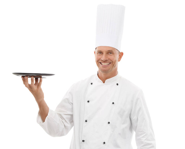 Chef holding tray, confident portrait and smile presenting promo or restaurant product placement isolated on white background Happy executive cook man in uniform, mock up and menu launch in studio - Foto, Imagen
