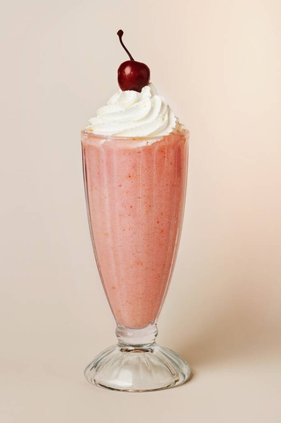 Strawberry milkshake with a maraschino cherry on top - Photo, Image
