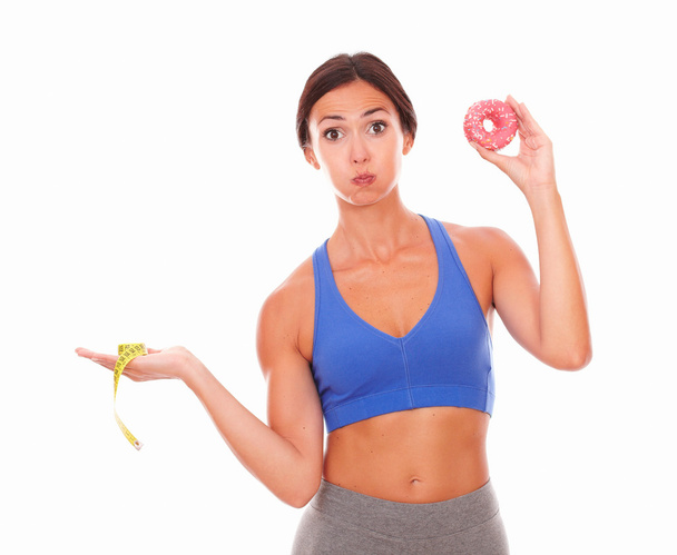 Karcsú hölgy közötti választás cukor és fitness - Fotó, kép