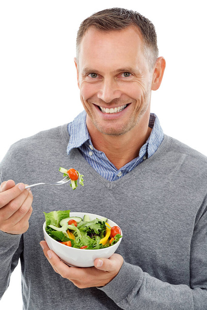 Man, green salad and portrait for health, diet and wellness isolated on a white background. Happy model person with vegan nutrition food bowl for healthy lifestyle, motivation and eating vegetables. - Photo, image