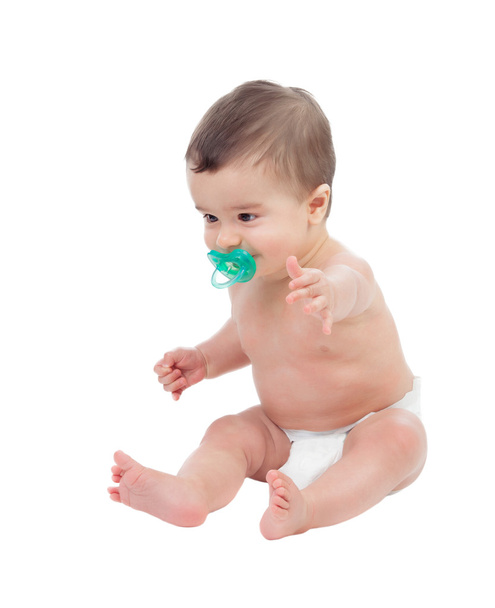 Schattig zes maand baby in luier met fopspeen - Foto, afbeelding