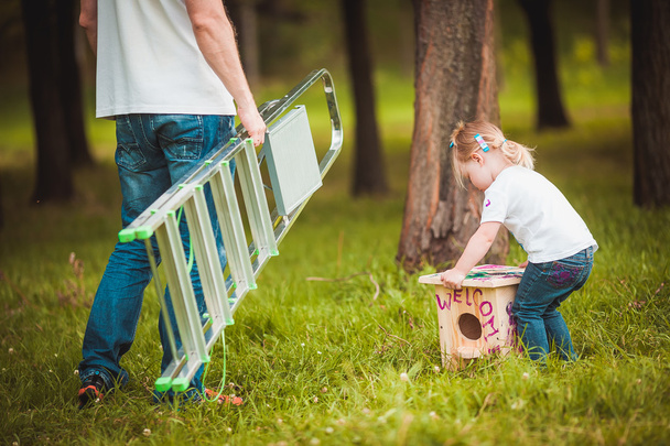Father making birdhouse with daughter - Foto, Imagem