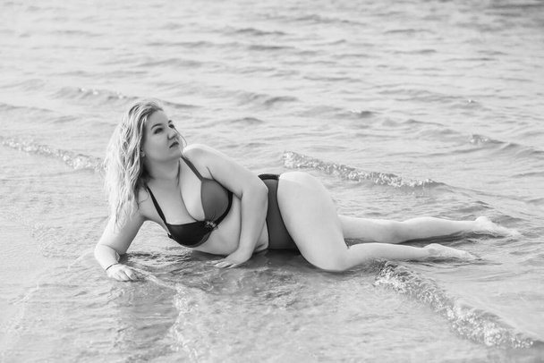 Plus size woman in water in swimsuit. Chubby nice lady, body positive concept, different women sizes - Zdjęcie, obraz