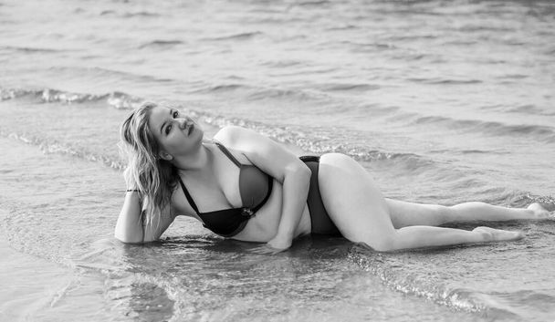 Plus size woman in water in swimsuit. Chubby nice lady, body positive concept, different women sizes - Photo, Image