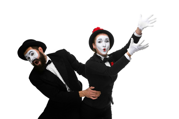 mime holding another one up and running - Foto, Imagen