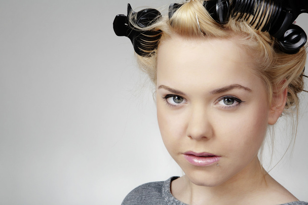 Teen aged girl with rollers - Photo, Image