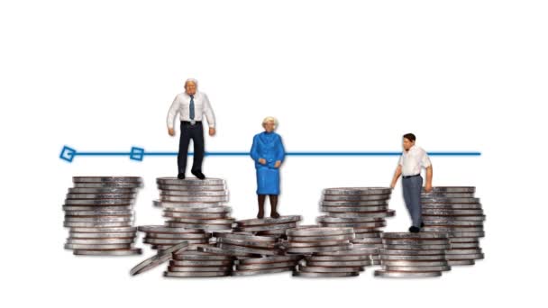 Concepts of an aging society and economic difficulties. Business concept with piles of coins and miniature people. - Footage, Video
