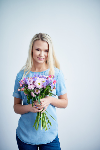 girl with various flowers - Photo, Image