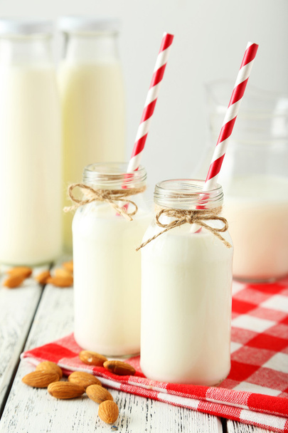 Two bottles of milk and almonds - Foto, Bild