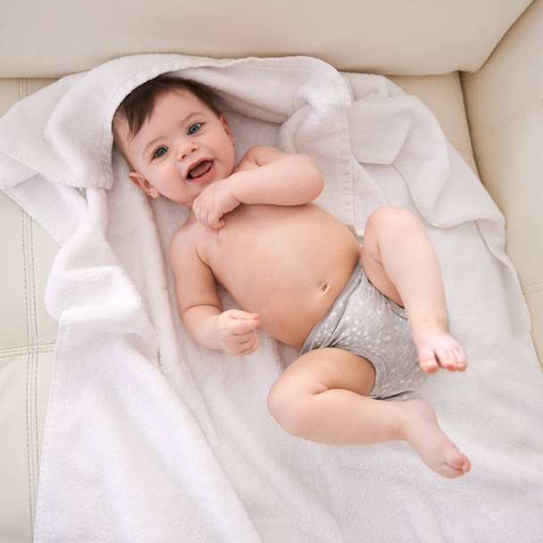Looking at you. Portrait of an adorable baby boy lying down on a blanket - Foto, Imagen