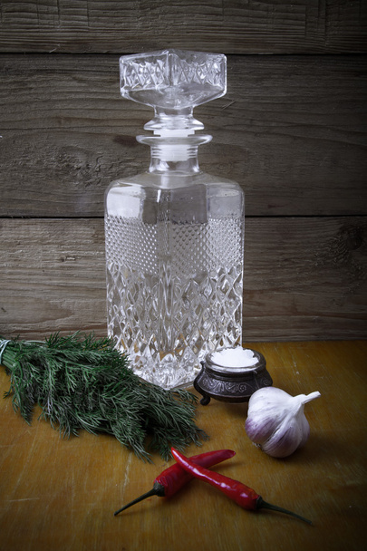 Carved decanter of vodka and ingredients for tinctures. Tinted. - Фото, зображення
