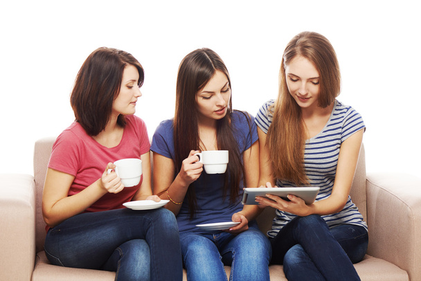Three girls friends using tablet - Valokuva, kuva