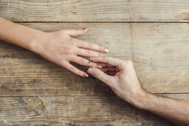 Man offering a wedding ring tenderly to a woman - Foto, imagen