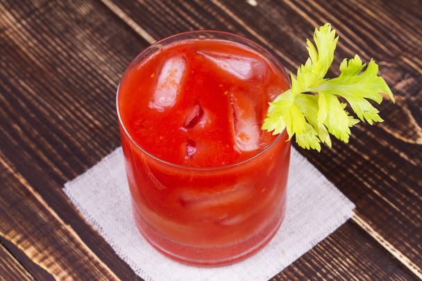 Spice and Salt Bloody Mary Cocktail on wooden background - 写真・画像