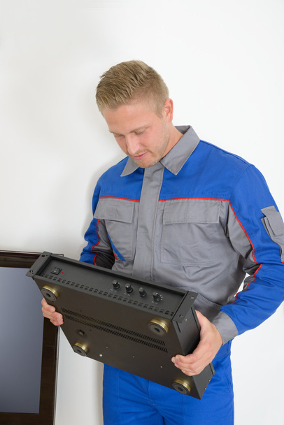 Technician Holding Amplifier - Photo, Image