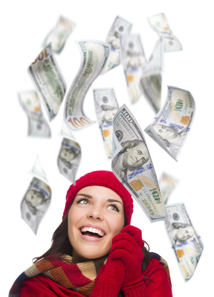 Joven mujer emocionada con cientos de dólares que caen a su alrededor
 - Foto, imagen