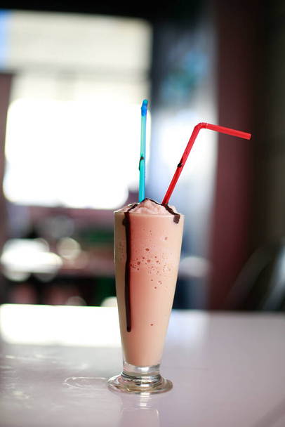 glass of fresh milkshake on  table - Zdjęcie, obraz